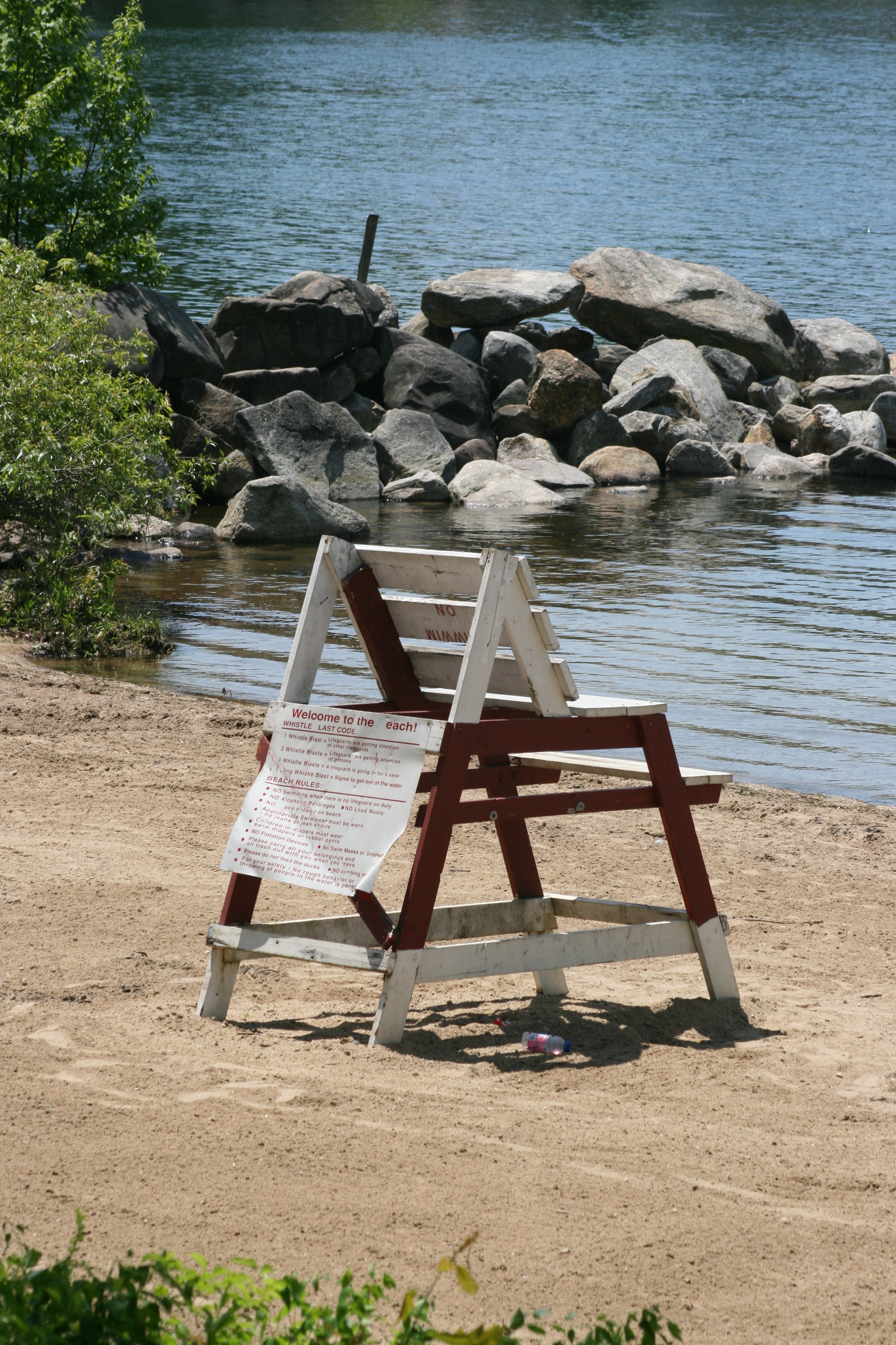 Beach rules on wooden chair