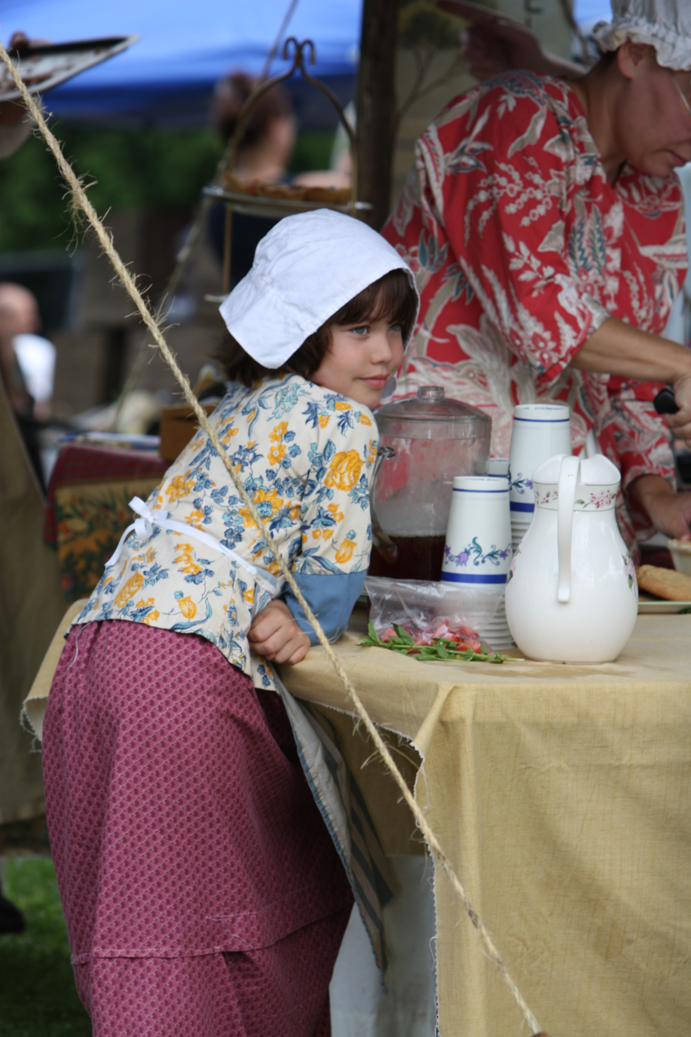 Young girl leaning on table