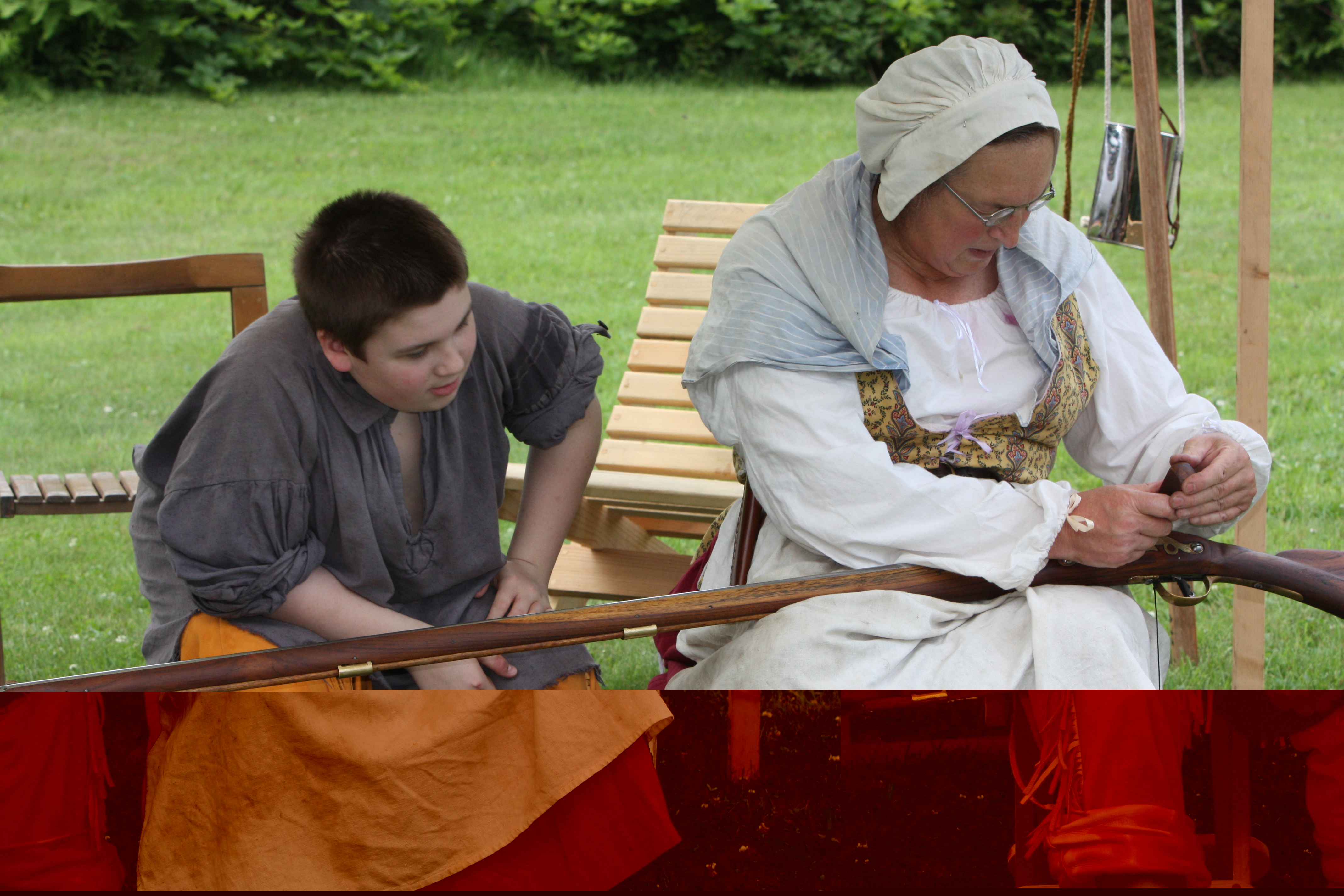 Young boy and woman sitting