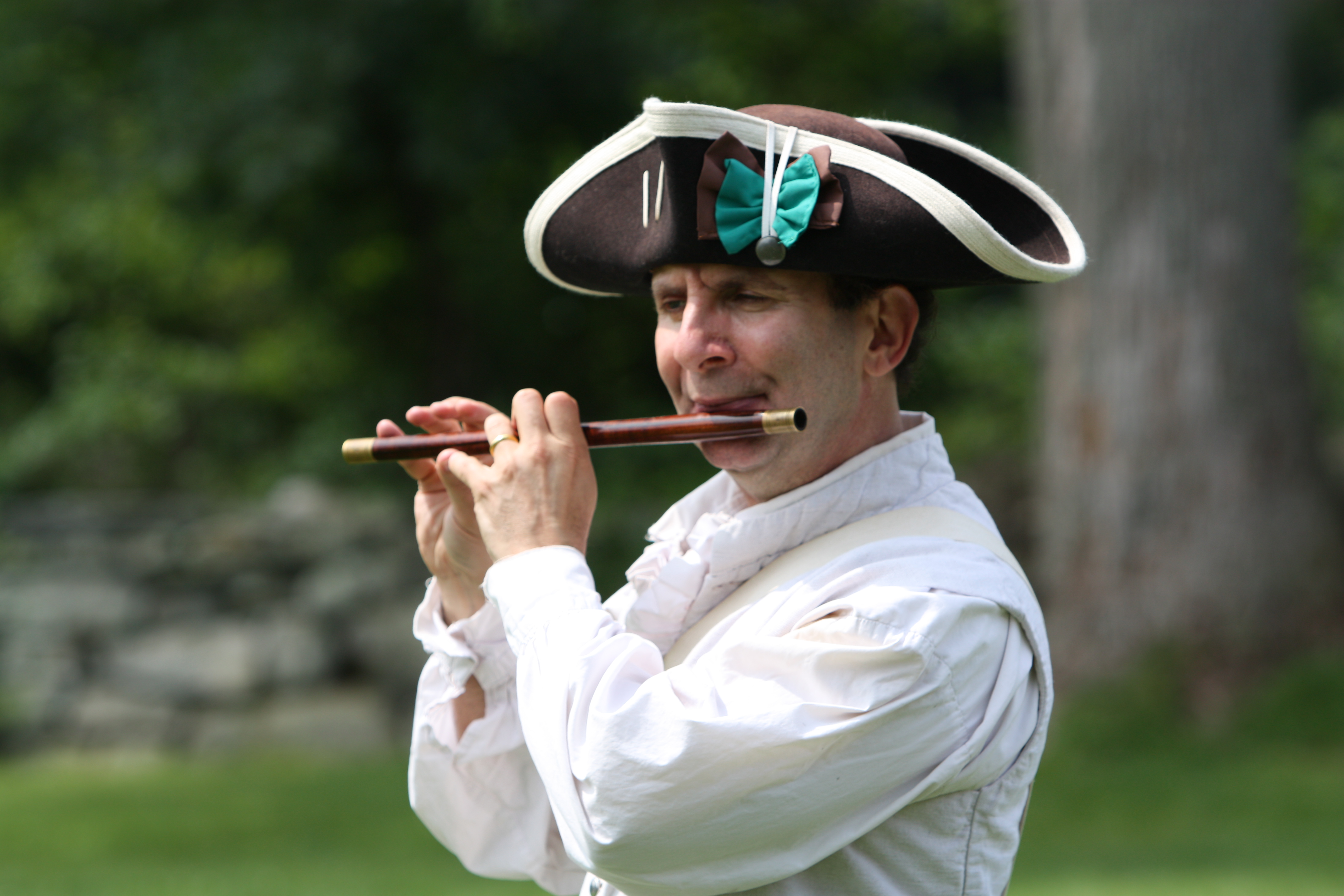Reenactment member playing music