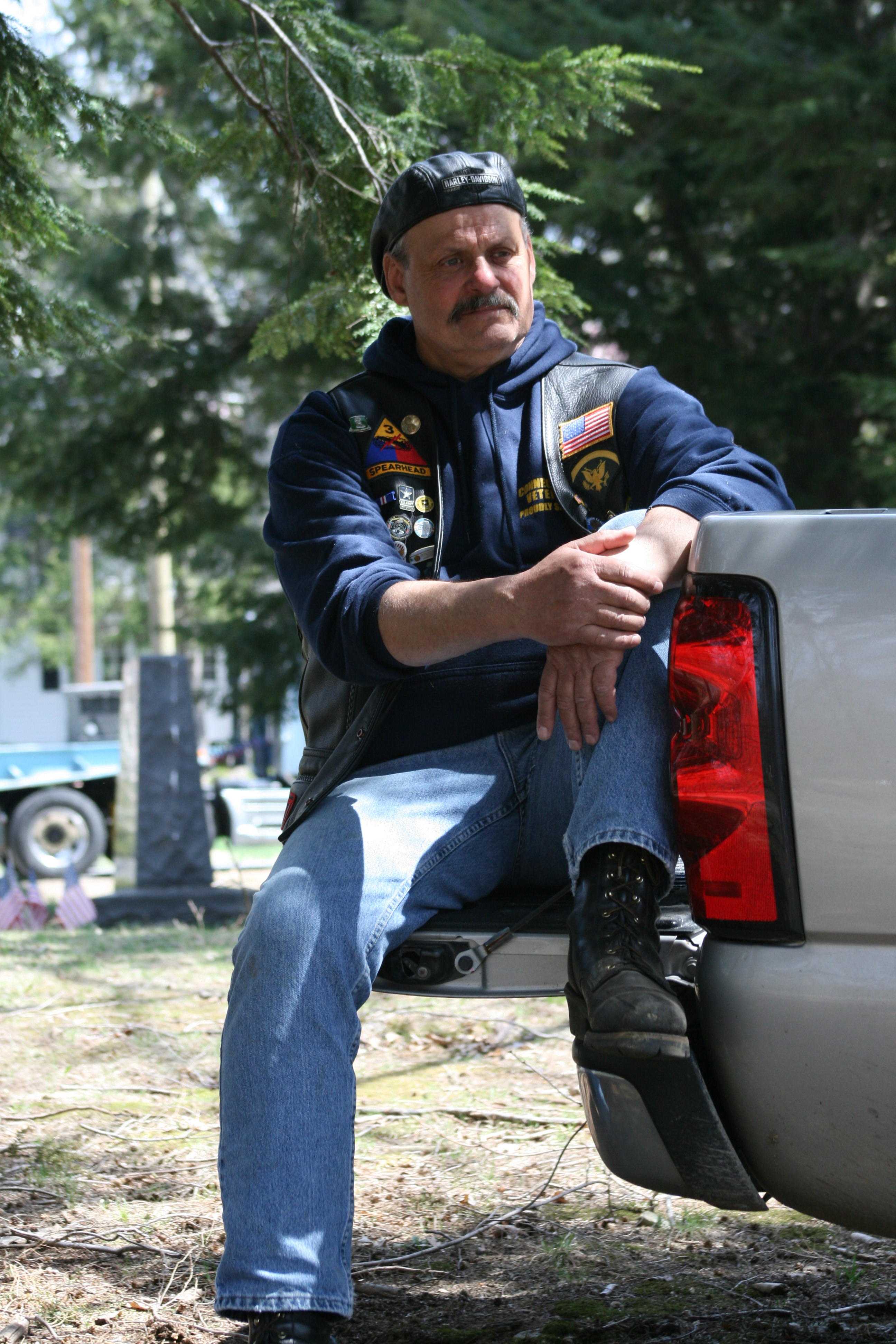 Veteran sitting on a tailgate