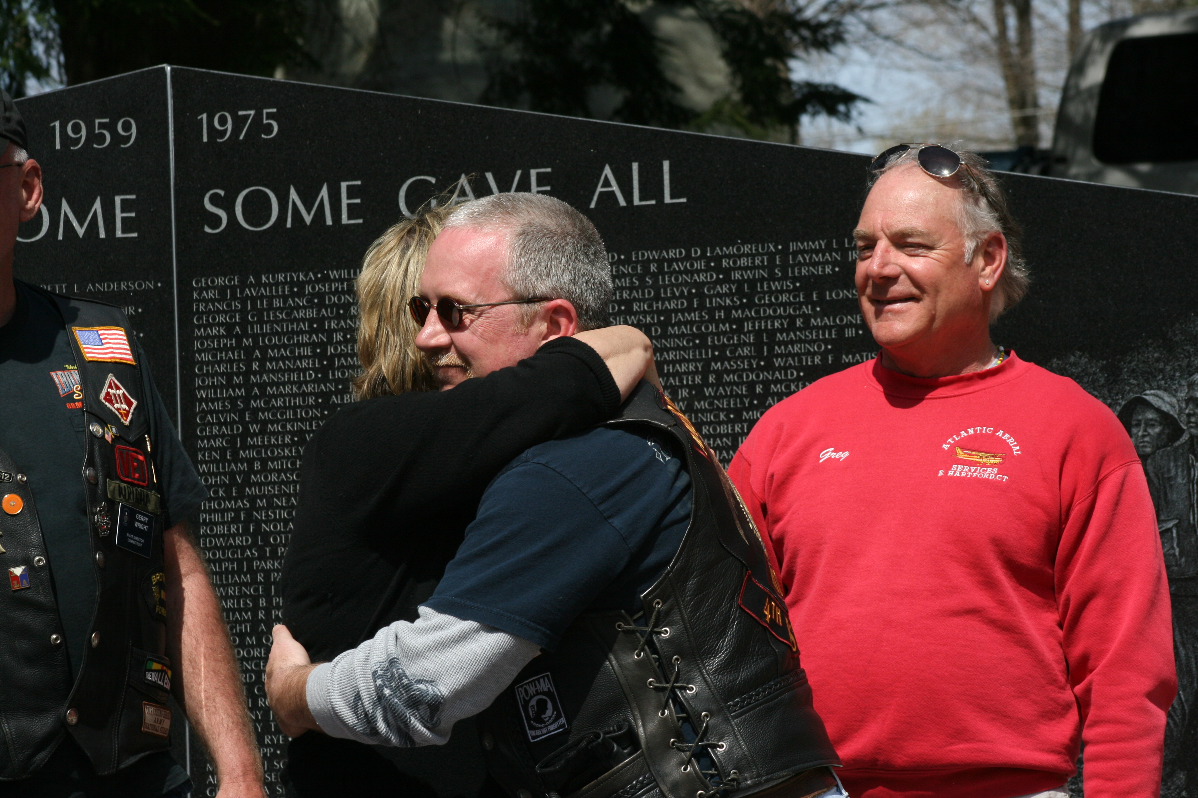 Crowd members embracing