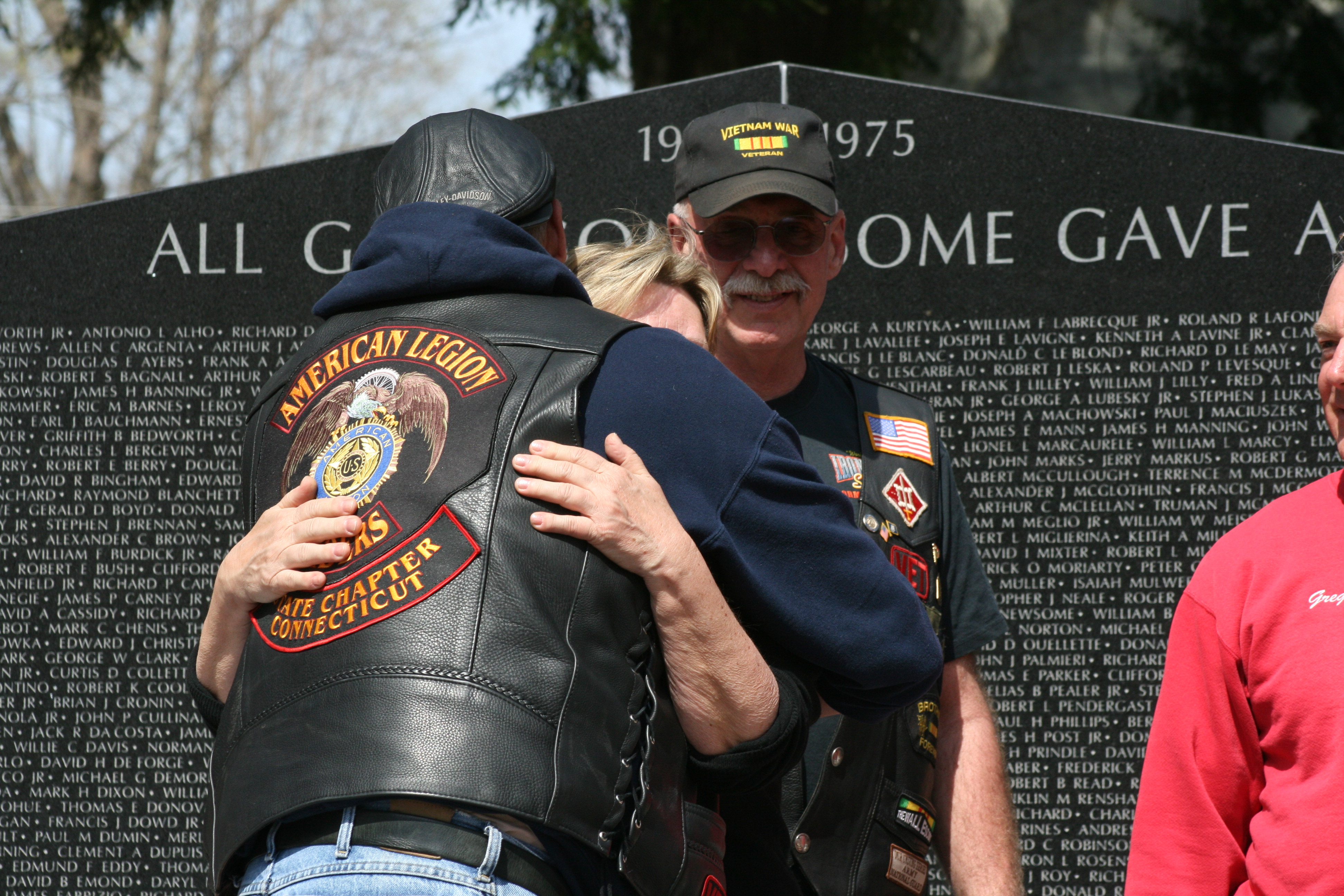 Crowd members embrace