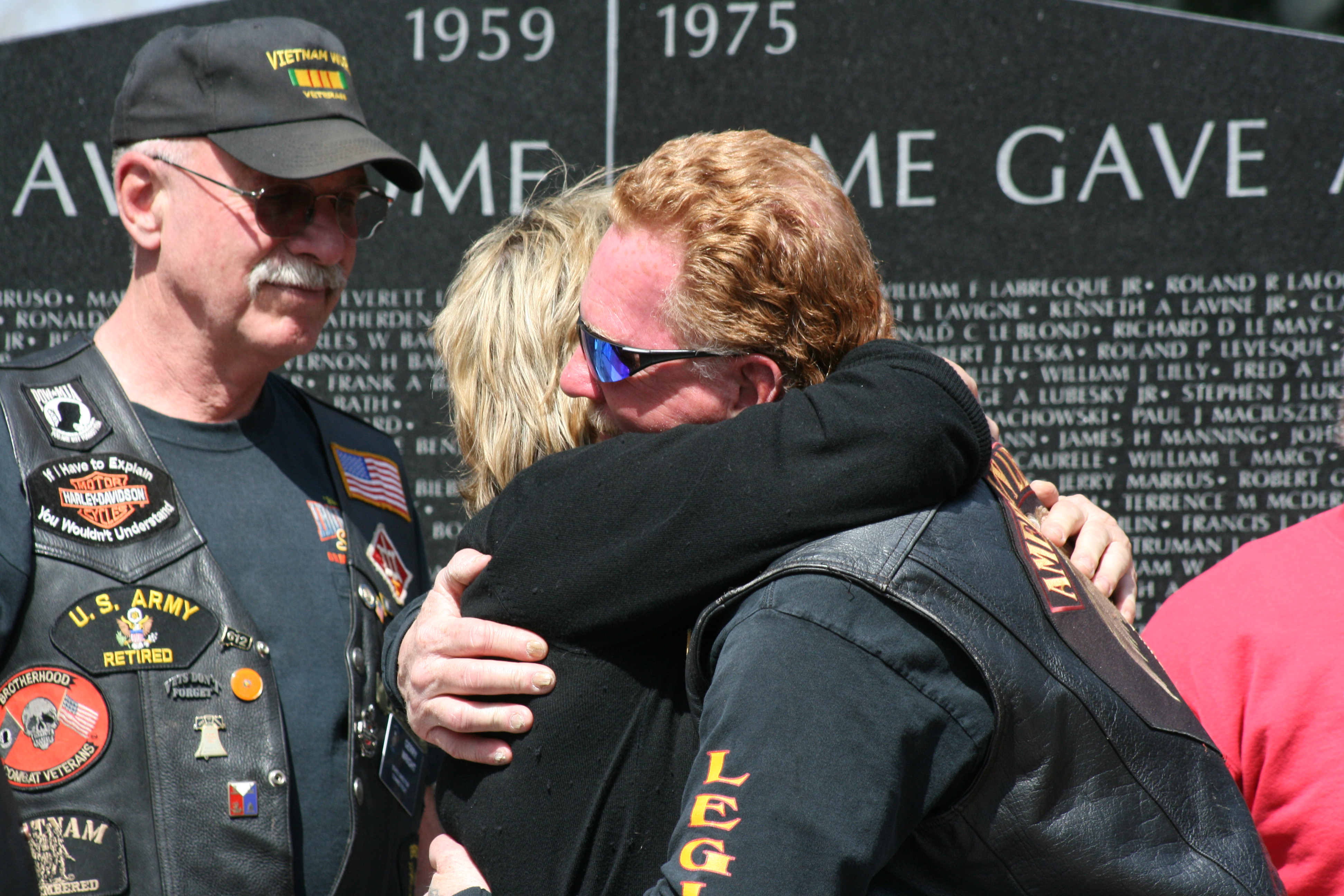 Crowd members embrace